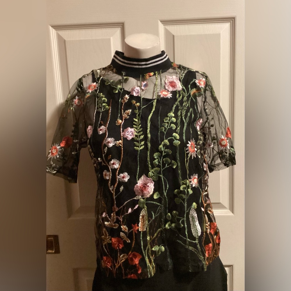 BLACK FLORAL EMBROIDERED TOP WITH MOCK BLACK AND WHITE TURTLE NECK